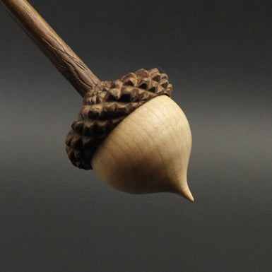 Acorn support spindle in curly maple and walnut