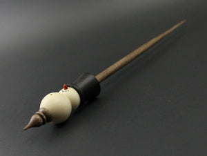 Snowman support spindle in holly, Indian ebony, and walnut