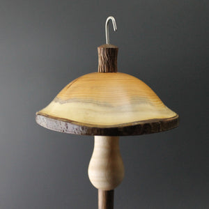 Mushroom drop spindle in yew, curly maple, and walnut